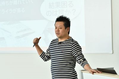 写真:登壇中の名村さん。説明に納得です。